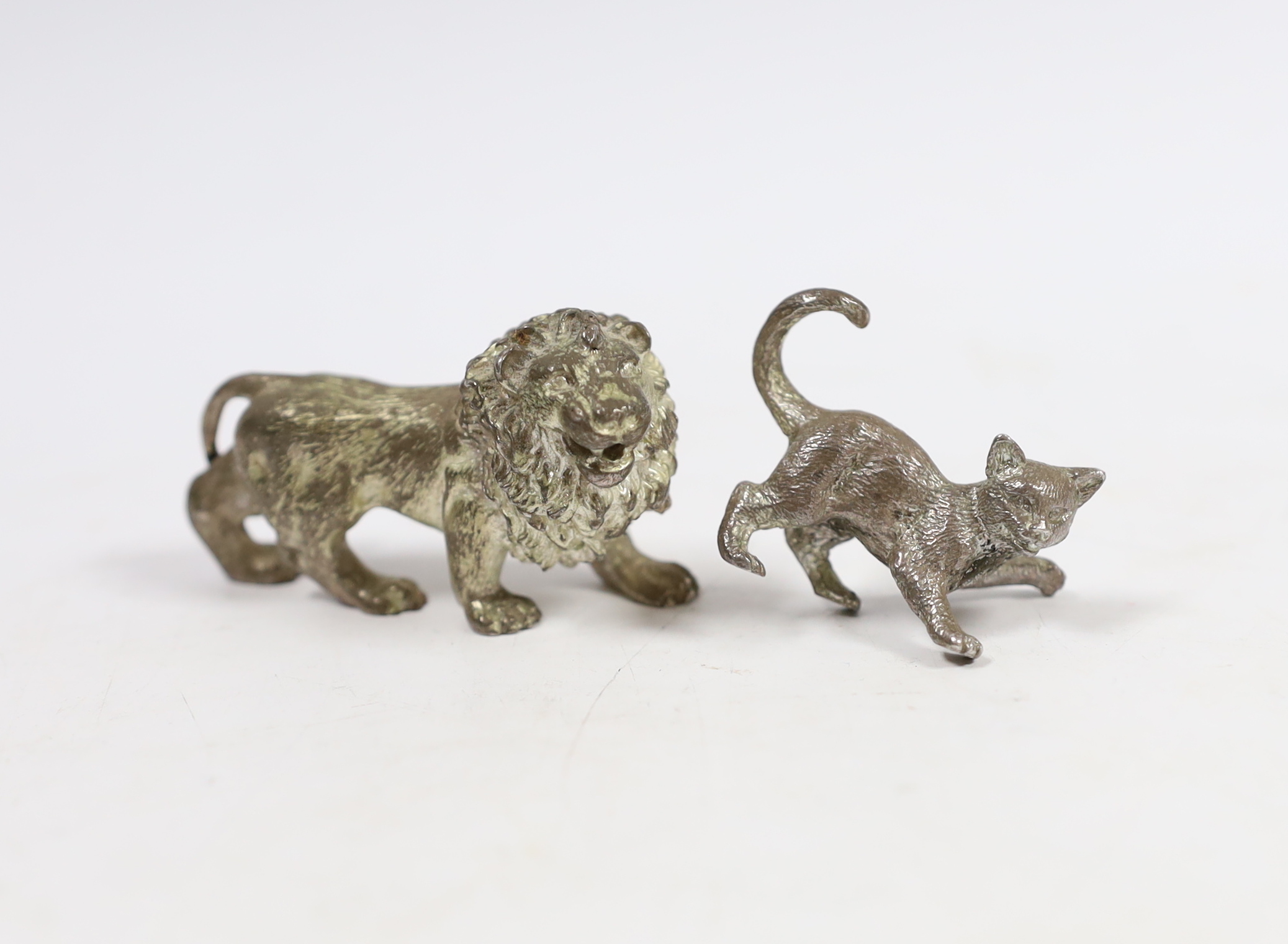 Two early 21st century silver miniature model animals, lion and playful kitten, London, 2003, lion length 55mm.